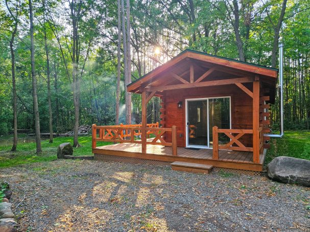 Front outside of cabin with sliding glass doors.