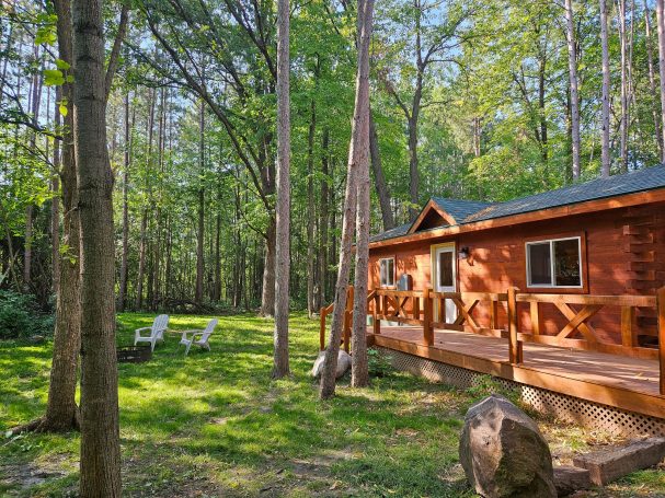 Side view of cabin in the woods.