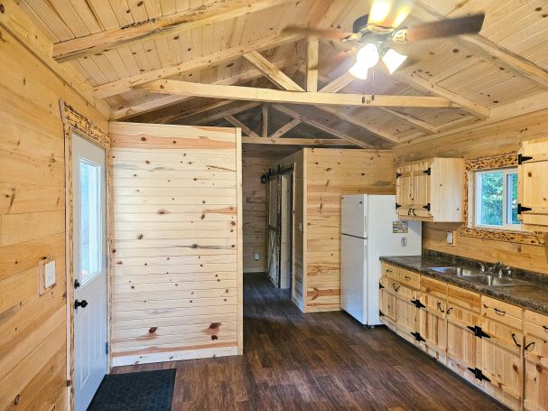 Inside of cabin kitchen and bedroom.